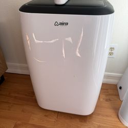  AIRO COMFORT - 14,000 BTU (10,000 BTU DOE) Portable Air Conditioner Cools 700 sq. ft. with Dehumidifier and LCD Remote in White AIRO COMFORT - 14,000