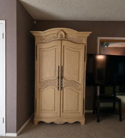 Elegant Armoire/Dresser with Intricate Detailing
