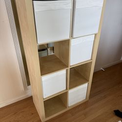 Bookshelf with cloth bins