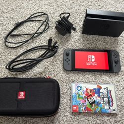 Nintendo Switch Console with Carrying Case and Mario Wonder