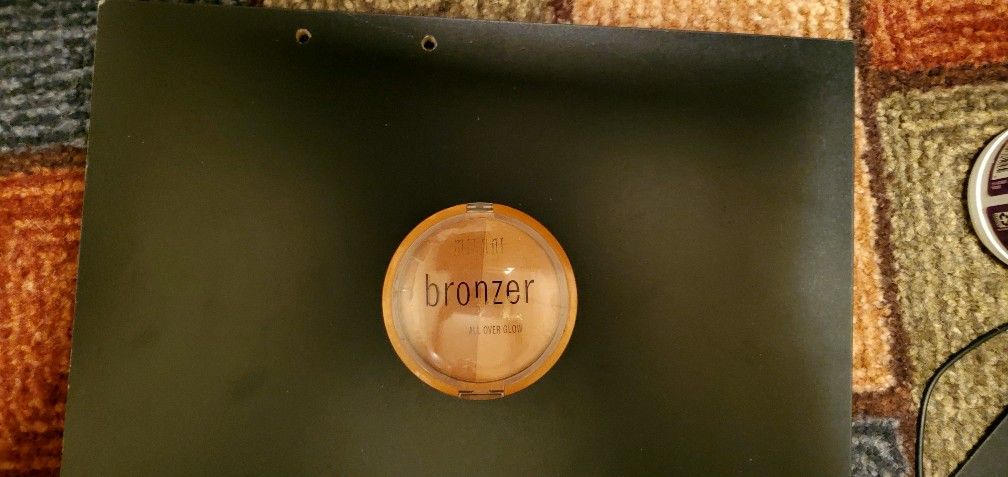 Milani Bronzer XL All Over Glow powder bronzer. 