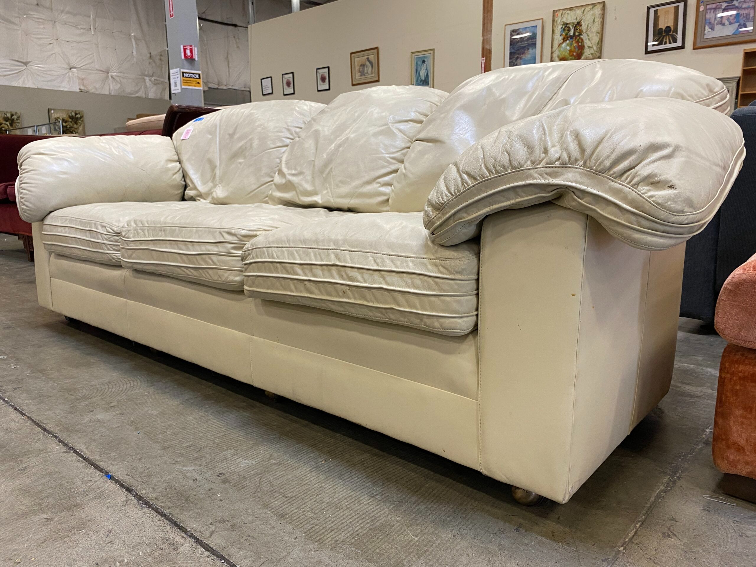 HANCOCK & MOORE Vintage Ivory Leather 3 Seat Sofa with Pipping Detail and on Casters