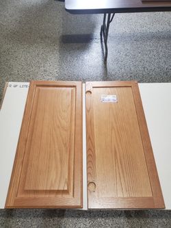 New never used oak cabinet doors with slow close cutouts for hinges.
