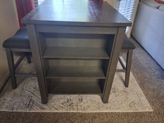 1 Table with 2 chairs, one couch and a computer desk