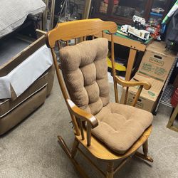 Wooden rocking chair with cushion