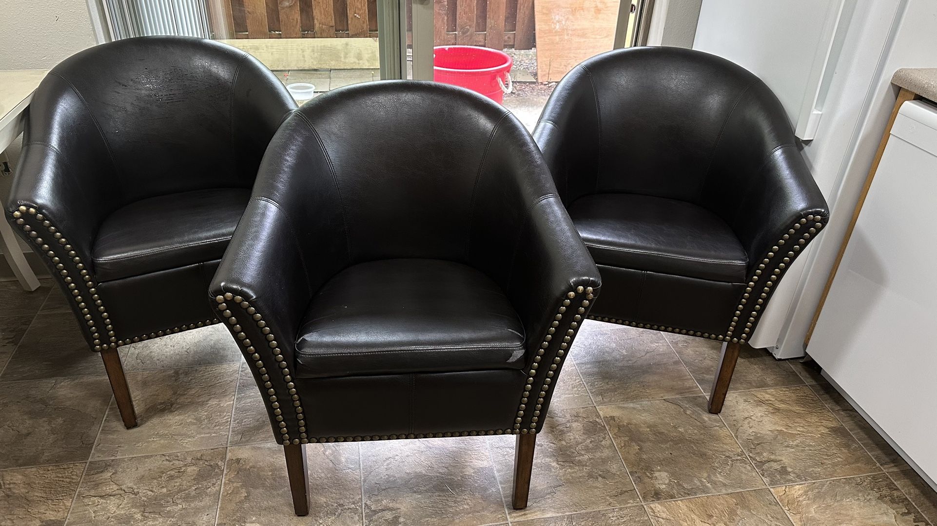 Three Leather Chairs