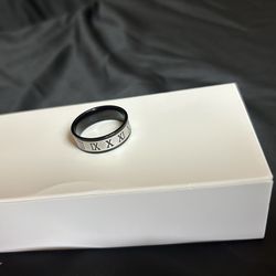 ⚡ Men’s Silver & Black Roman Numeral Ring – Size 13 | Trades Welcome! This sharp two-tone ring features a silver band with Roman numeral engravings an