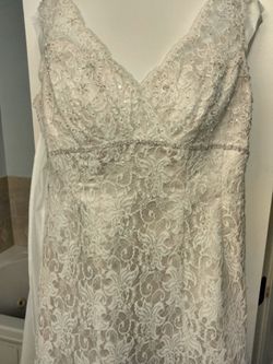 David's Bridal T9612 trumpet wedding gown featuring intricate beaded lace.