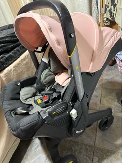Doona stroller/base / infant inserts $260 Great condition except canopy has peeling do to drying . But no holes .