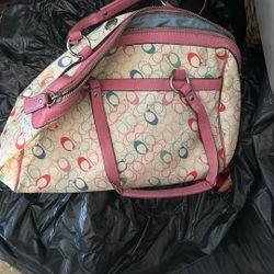 Coach Signature C print bag with pink leather trim.