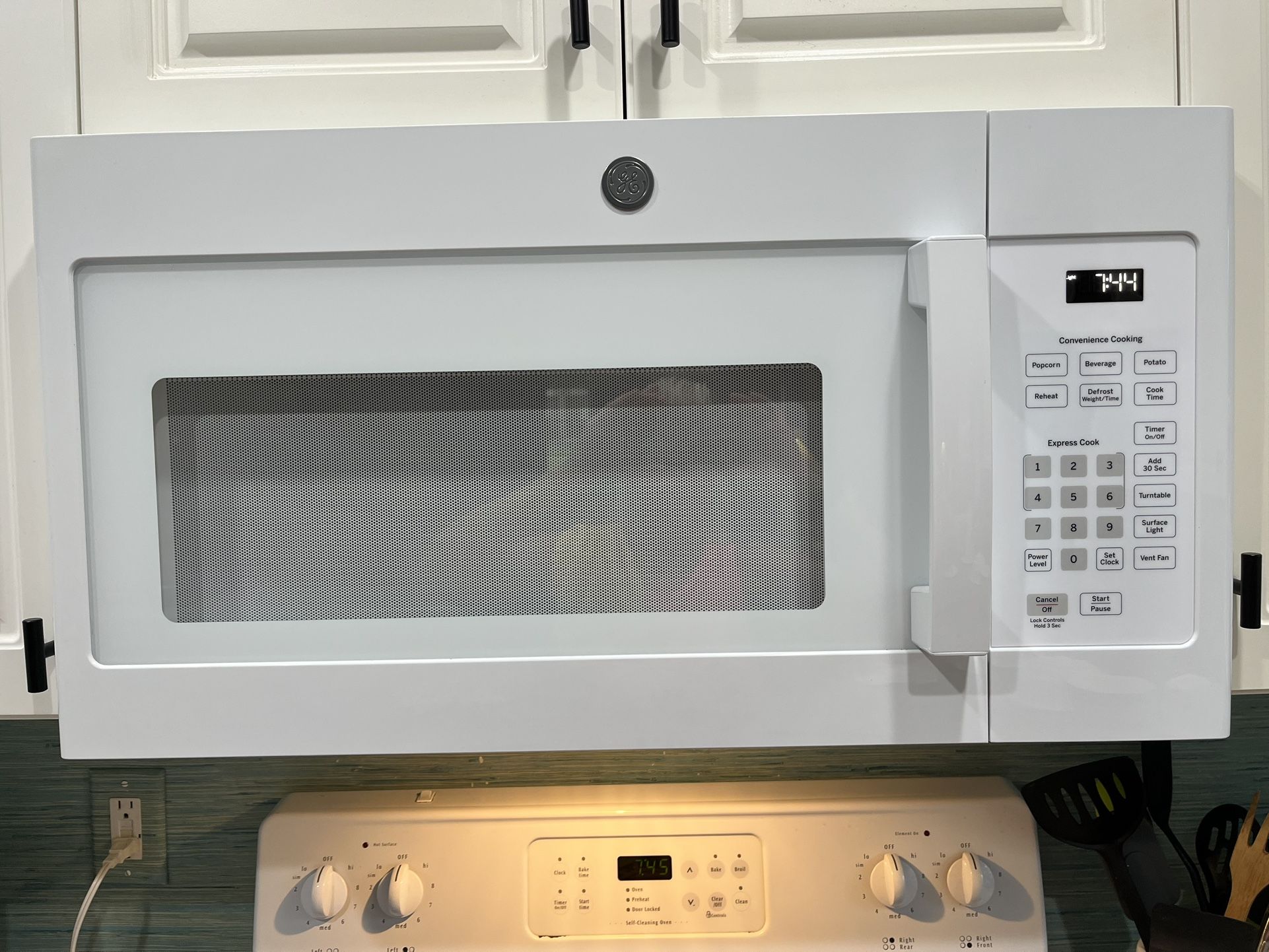 NEW WHITE GE OVER THE RANGE MICROWAVE