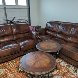 100% Leather living room set. LG Cowboy top-grain leather sofa and loveseat with two end tables.