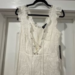 Lulus White Embroidered Romper with ruffles and tie-up corset front