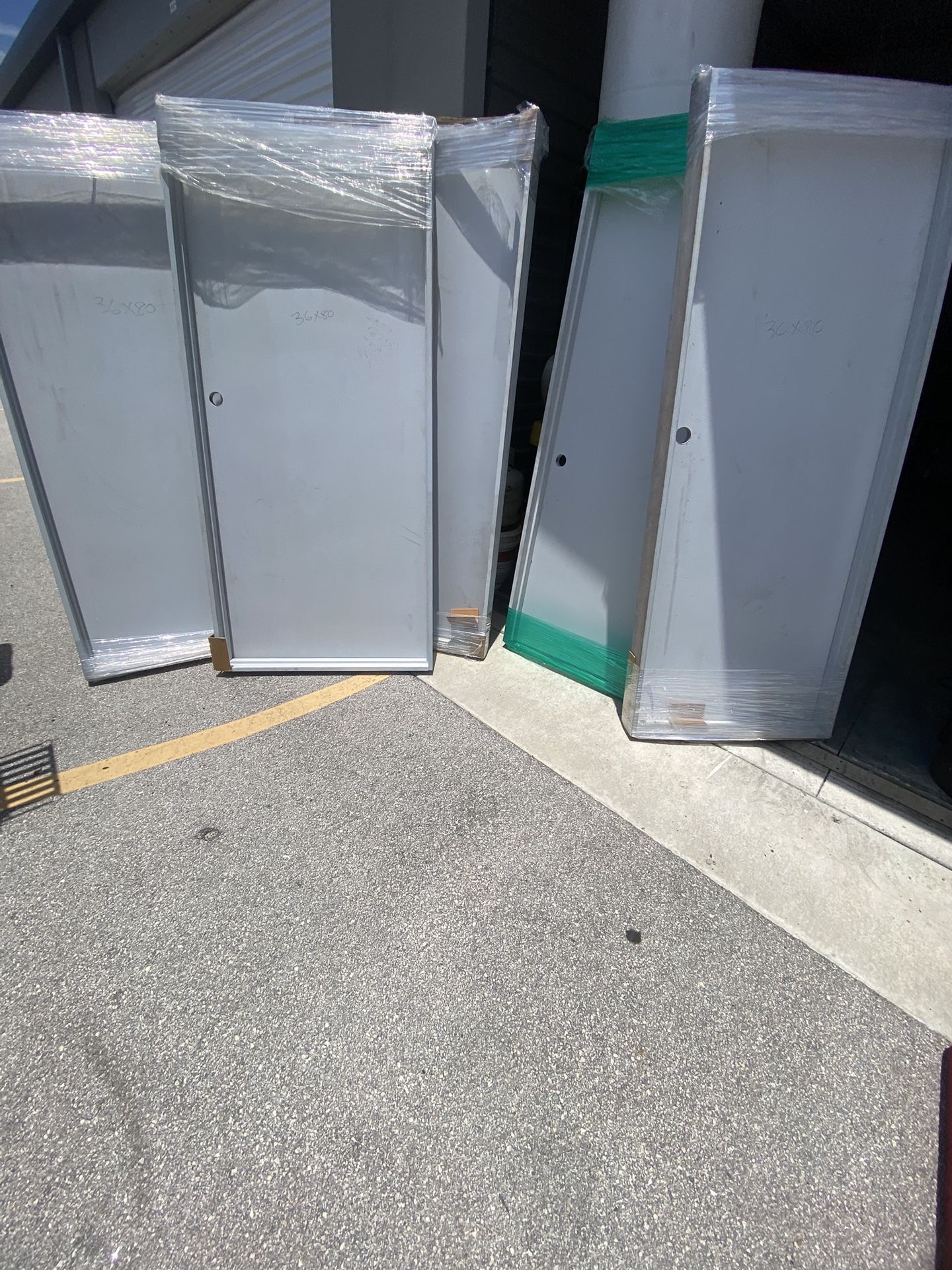 20 new interior doors with frames. All plain flat white doors. 30x80, 36x80 and 36x96. Solid wood and hollow core. Some have scratches. Starting at $
