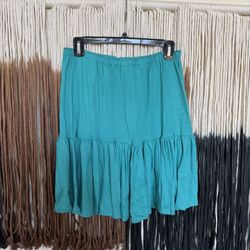 Turquoise mini skirt with ruffles; good condition