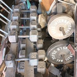 Iron Weights Dumbbells, Racks, Olympic Weights and miscellaneous as pictured 