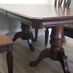 Hard Wooden Table With Eight Chairs.