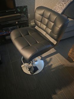 Black faux leather barstool