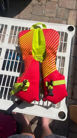 West Marine infant life jacket less than 30 pounds red and green
