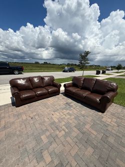 Two genuine leather couches- delivery available