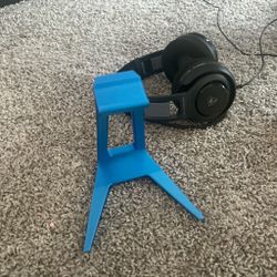Blue headphones stand