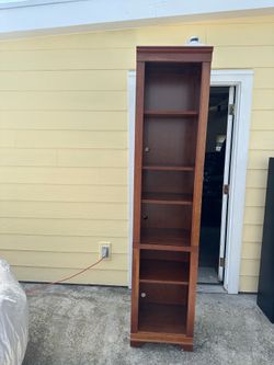 Tall solid wood cabinet with shelves