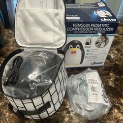 New penguin nebulizer with carrying bag never open