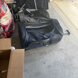 Tumi roller duffle bag.