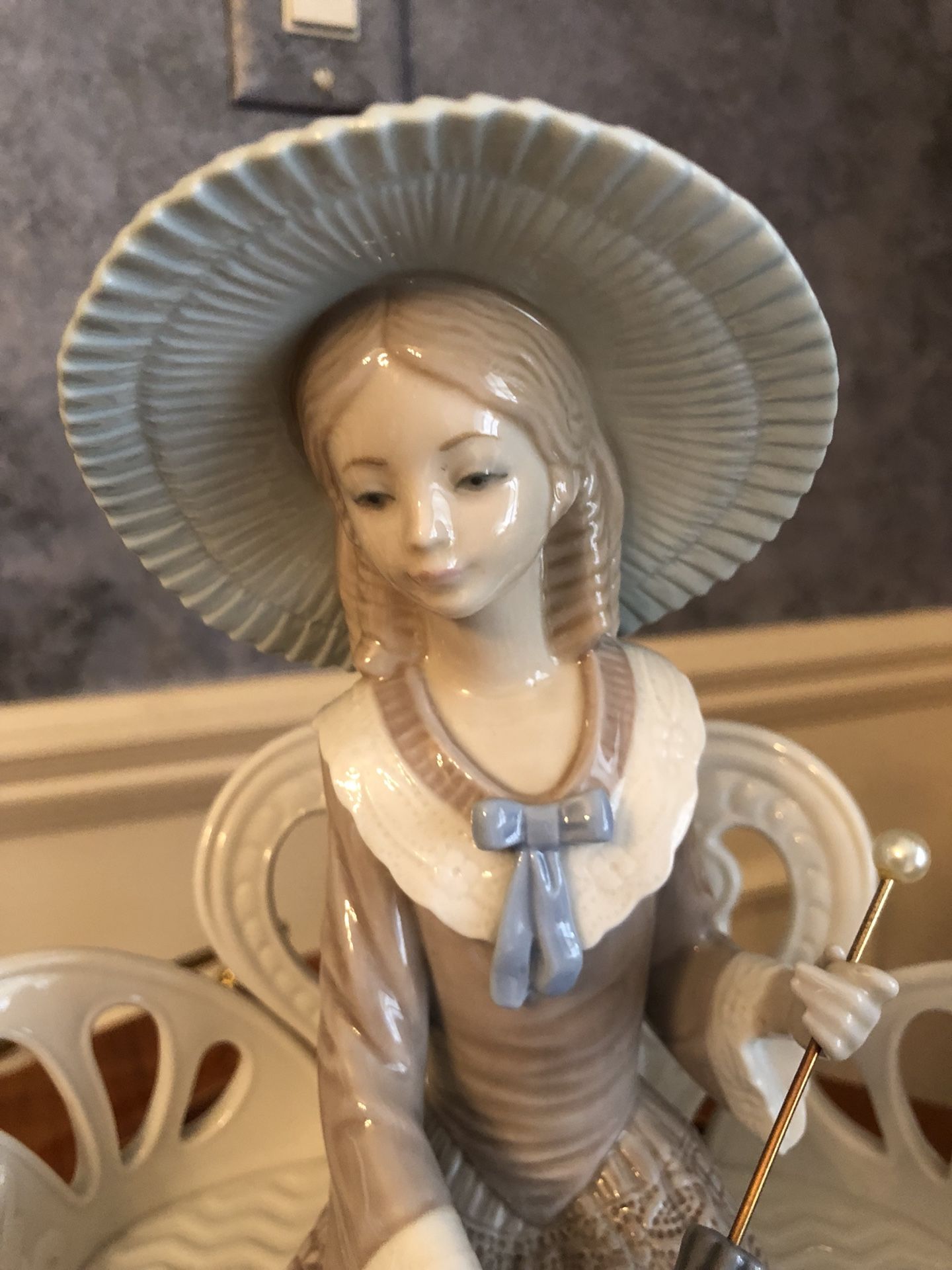 Lladro figurine “Waiting in the Park”