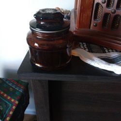 A Glass Container Dark Brown