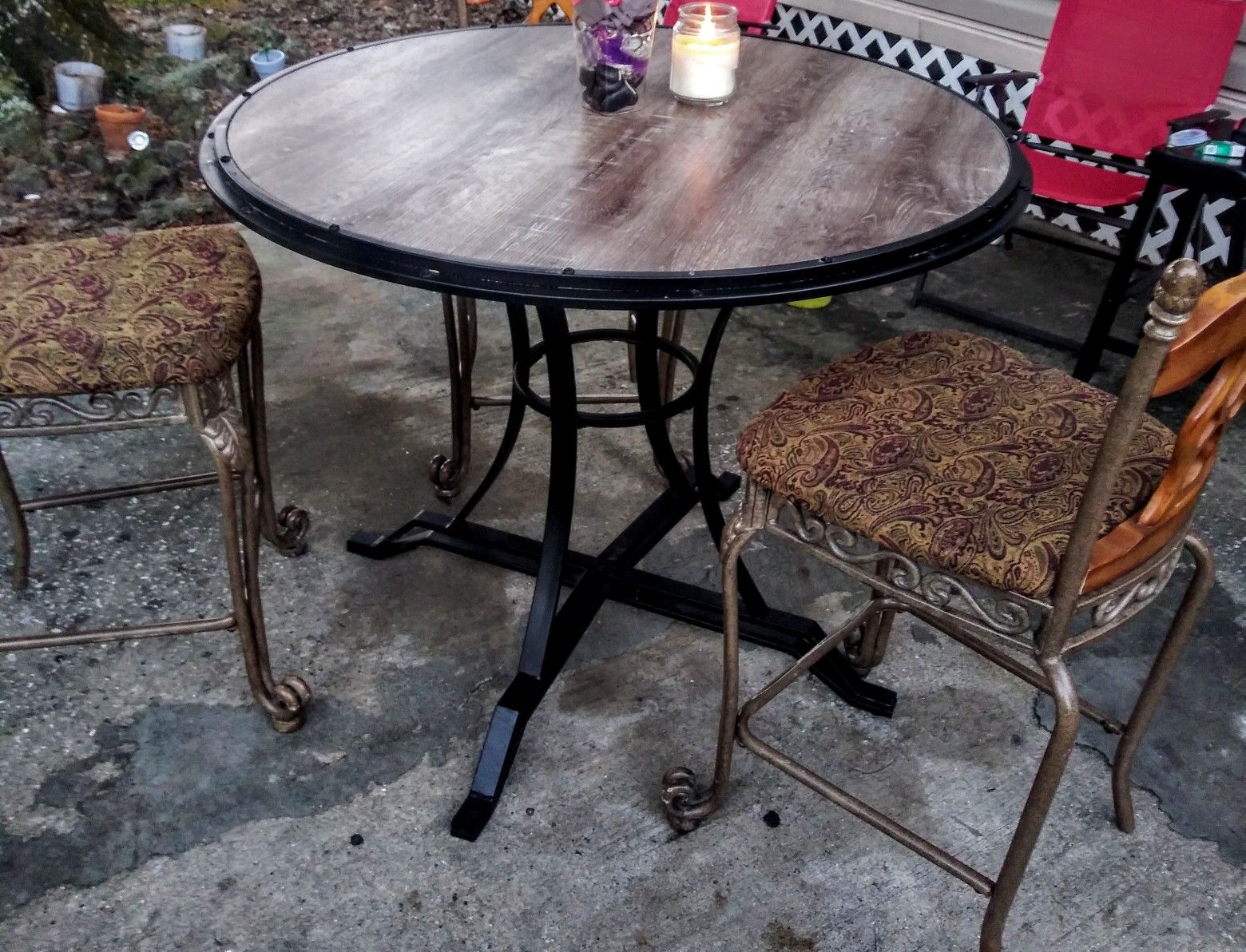 High top kitchen table with matching three chairs and I stopper