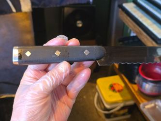 Serrated Kitchen Knife with Dark Handle
