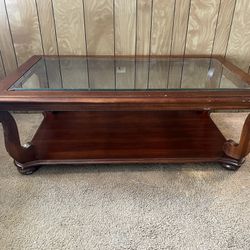 BROWN WOOD AND GLASS COFFEE TABLE