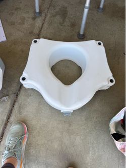 Raised toilet seat