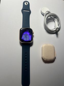 Never used Apple Watch series 10 gps + cellular 42mm rose gold with blue band S/M and charger. apple warranty