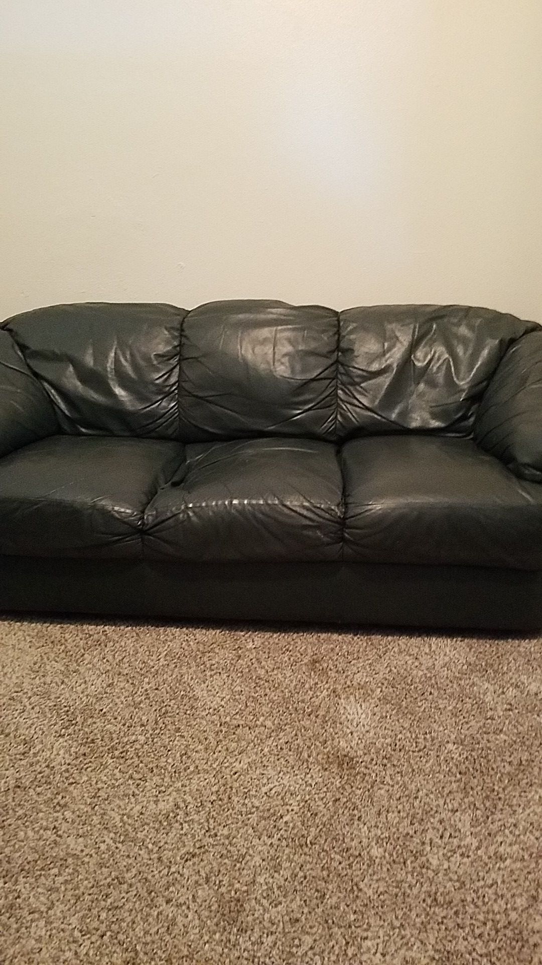 dark green pure leather couch with matching ottoman