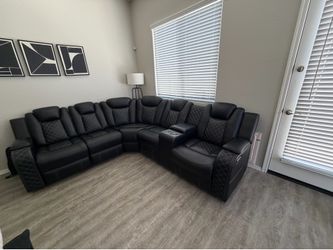 Black sectional powered recliner on each end
