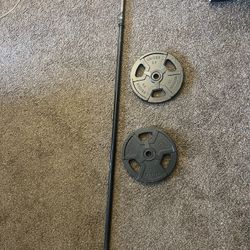Pair Of 25 lb Plates And 7ft Barbell 