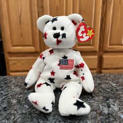 Ty Beanie “Glory”  The Bear 1997 Retired Plush Toy.  Brand new with tags.  Had been on display with a Ty Beanie Babie Collection.  Smoke free home 