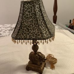 Gold elephant lamp with leopard shade