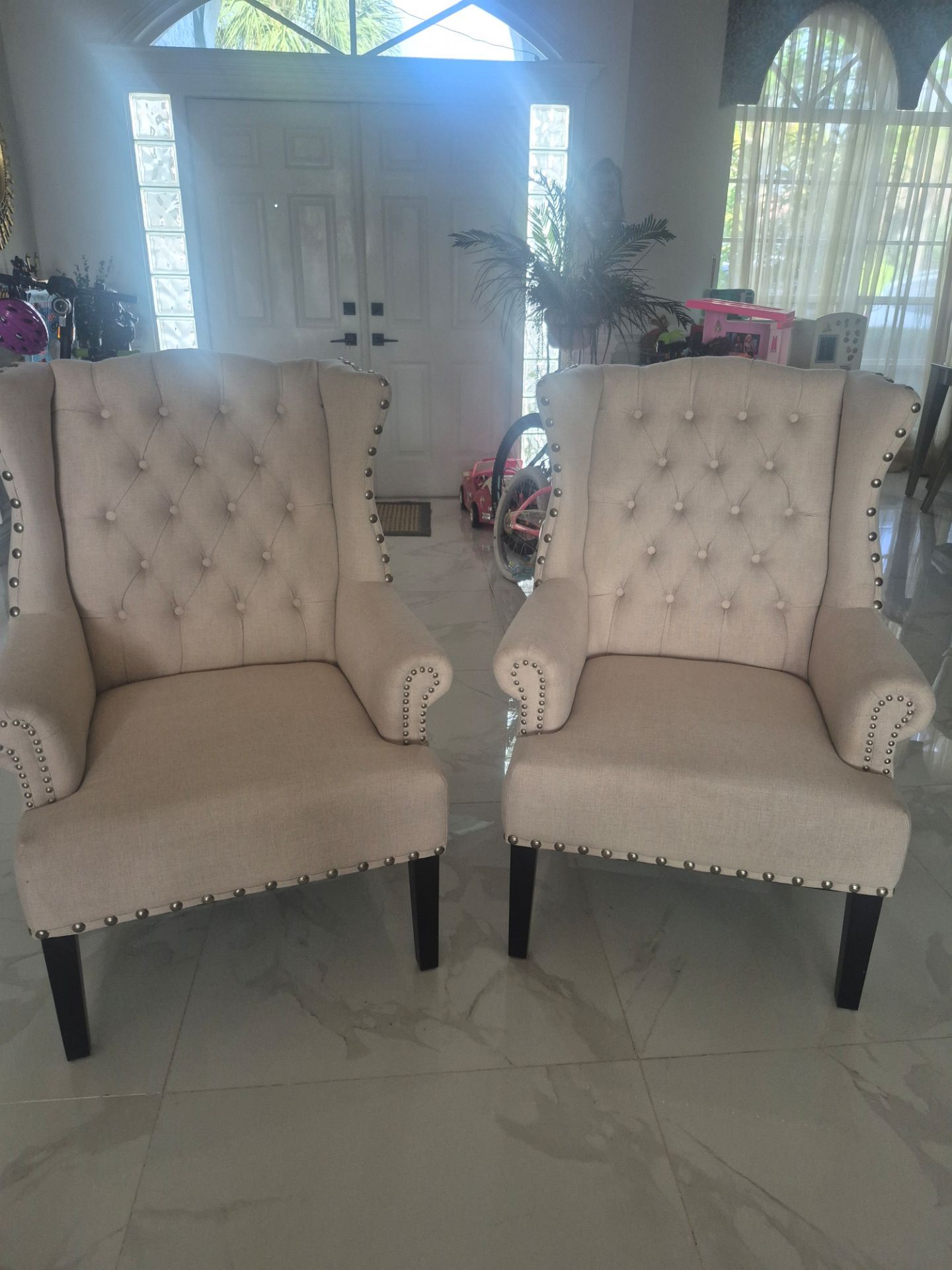 Set of two high back cloth chairs