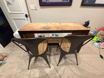 Wood and metal desk with chairs