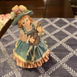 Music Box Porcelain doll the song is it’s a small world after all