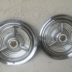 55 olds orig. Fiesta spinner hub caps