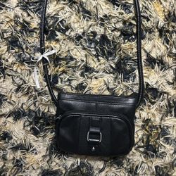 Black leather crossbody bag with silver hardware, featuring a zipper closure and multiple pockets
