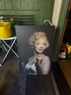 Life-size larger than life-size photo on a canvas of Marilyn Monroe.