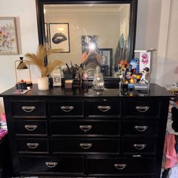 Black dresser with mirror and black nightstand 