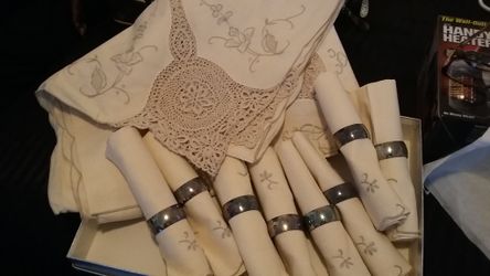 Beautiful embroidered / crocheted tablecloth with 8 matching napkins with silver plated rings