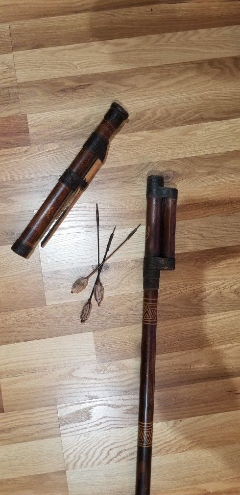 Old Authentic African bamboo blowgun with darts