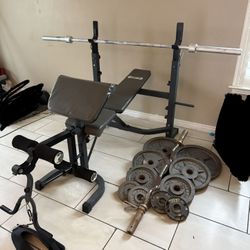 Bench press with Olympic weights 230lbs total plus curl bar and 7ft 45lbs bar